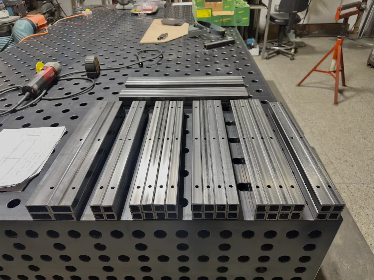 Stacks of drilled steel box tube