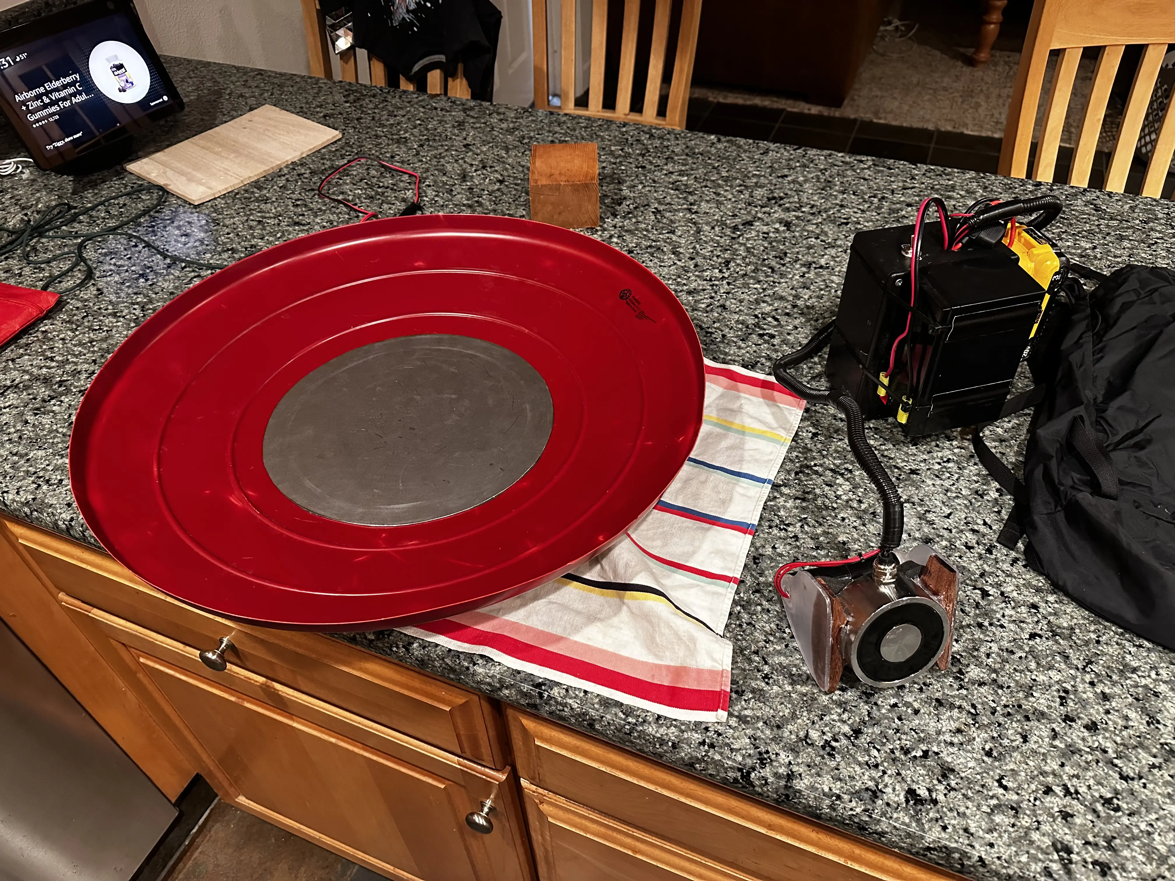 Image of wrist-mounted electromagnet and battery pack on table