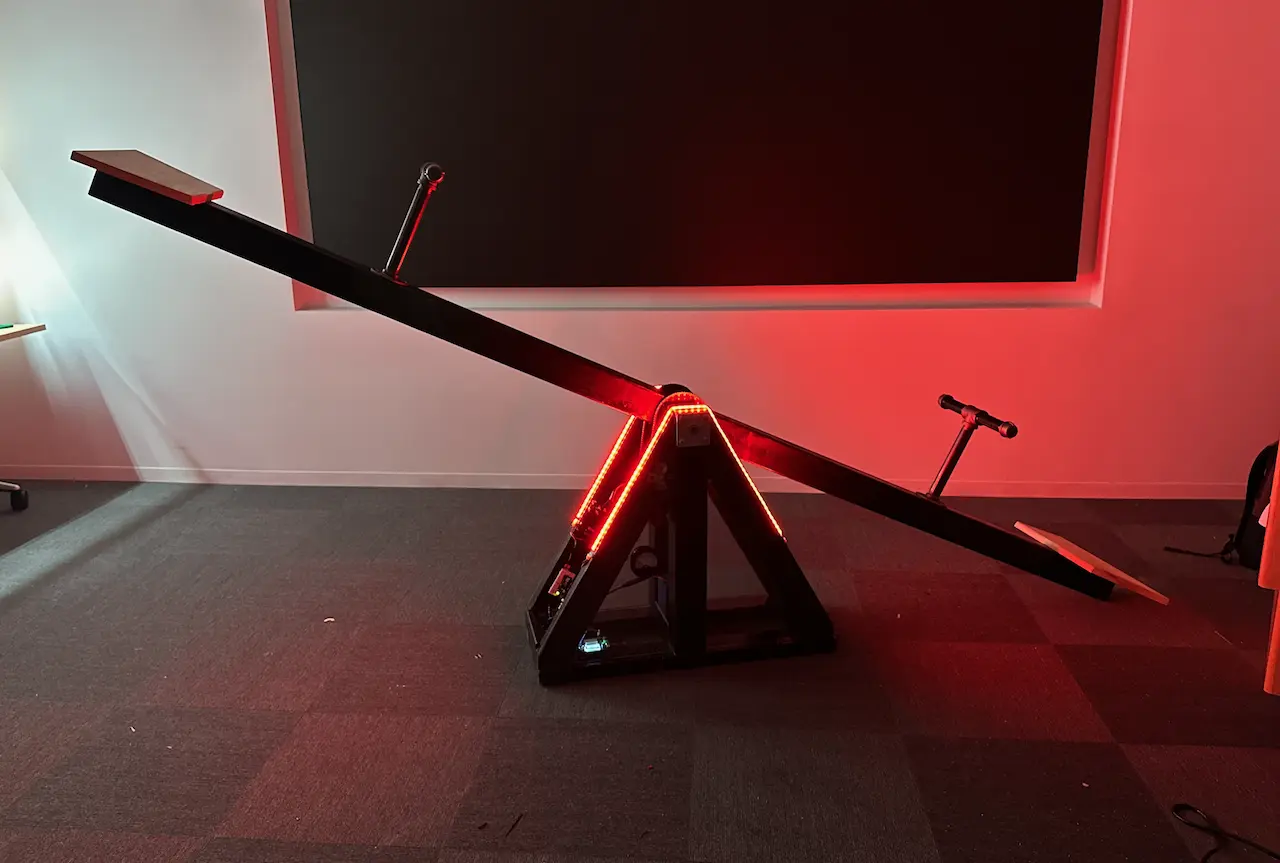 Image of see saw with red lights