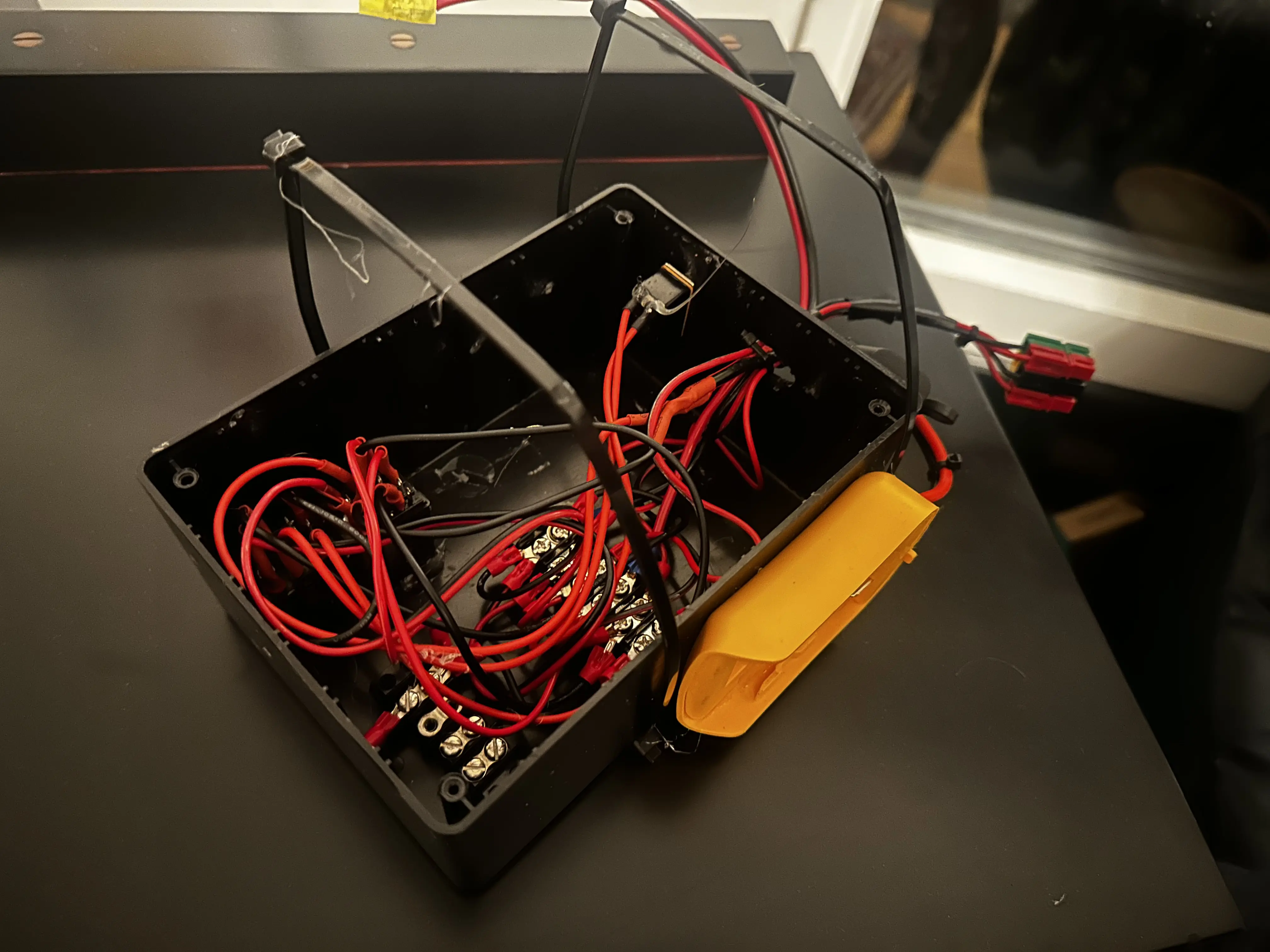 Image of wrist-mounted electromagnet and battery pack on table